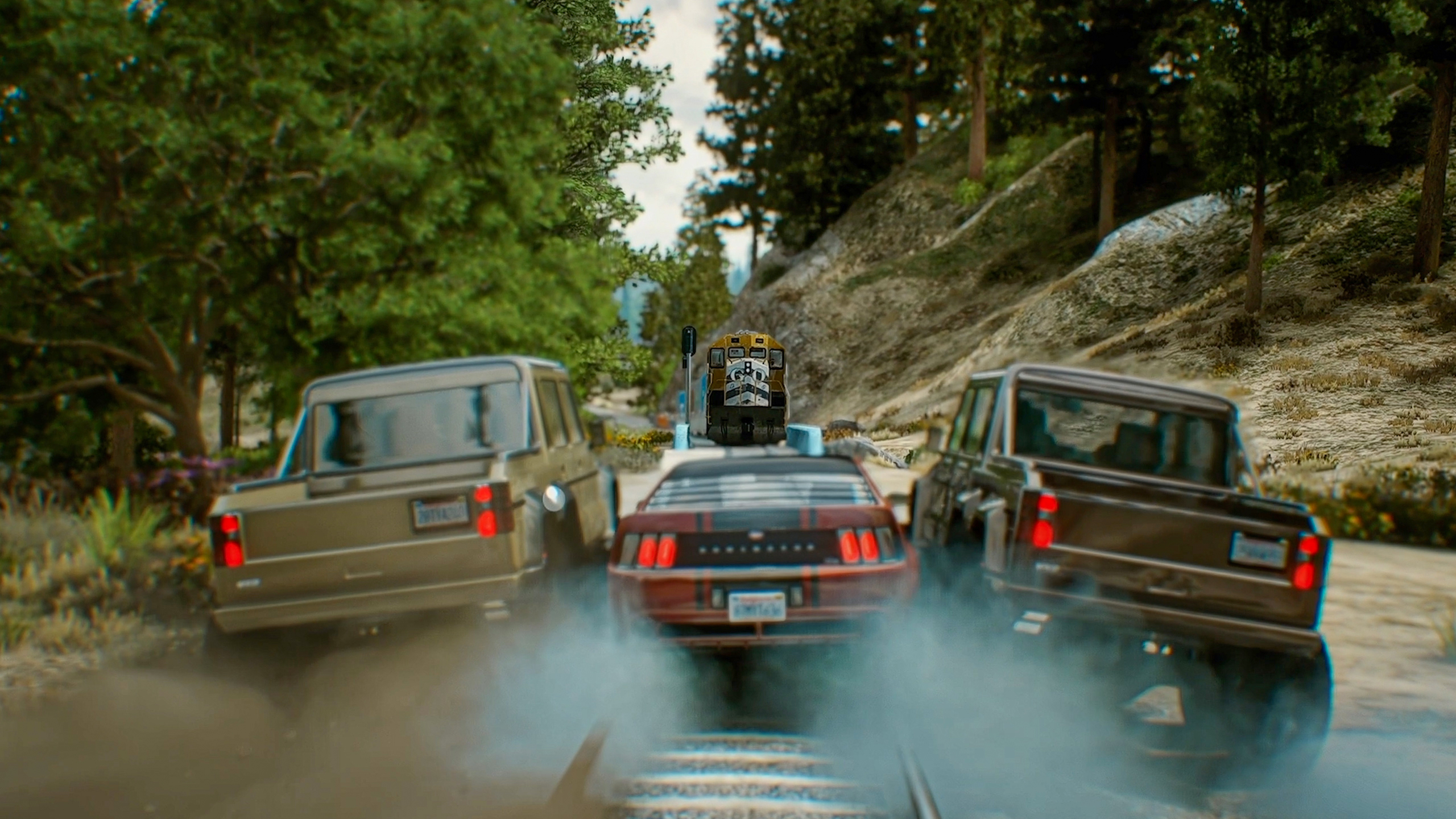 Two cars boxing in a third on a canyon road